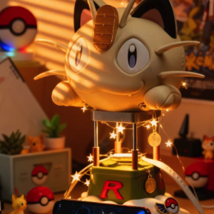Pokémon Meowth Team Rocket hot air balloon figure and phone displaying Meowth, surrounded by fairy lights and warm golden light.