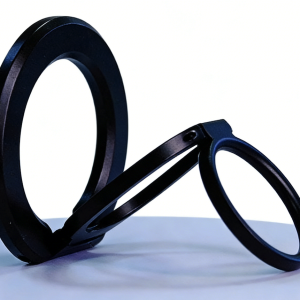 Matte black phone ring holder and kickstand, folded out, on a white background.