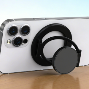 White smartphone with black magnetic ring holder kickstand, standing horizontally.